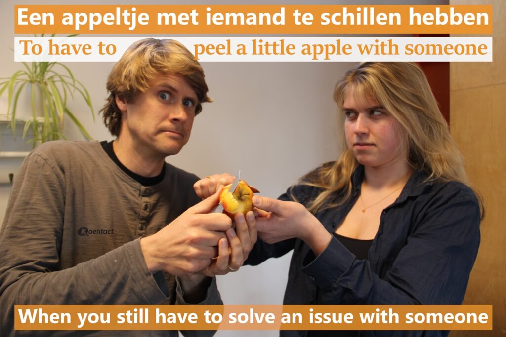 Dutch saying about apples: Een appeltje met iemand te schillen hebben